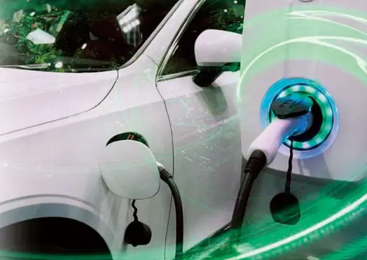 DNP-Pic-1 Close-up of an electric vehicle (EV) being charged at a charging station, representing battery pouch material applications in e-mobility, supplied by NAGASE.