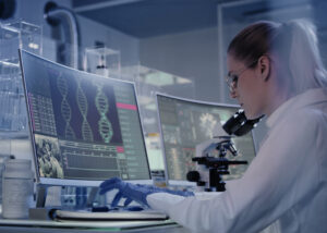 Scientist analyzing molecular data on computer screens in a research lab—illustrating Nagase’s Functional Dyes used in biotechnology, diagnostics, and advanced material applications for life science innovation.