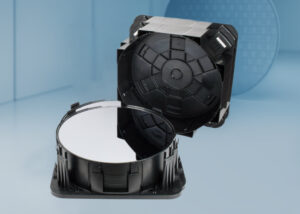 Horizontal Wafer Shipper by Nagase, featuring a black plastic container designed to securely hold and transport silicon wafers. The image shows the shipper with one wafer partially exposed, highlighting the protective structure and secure fit for delicate semiconductor materials.