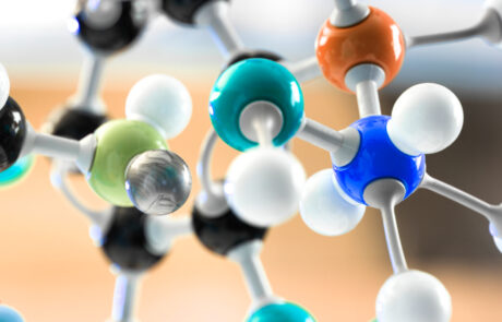 Close-up of a colorful molecular structure model symbolizing Denacol Acrylate DA-141 by Nagase, a low-viscosity reactive acrylate monomer used in UV-curable resins, coatings, adhesives, and printing inks for enhanced adhesion and flexibility.