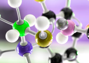Close-up of a colorful molecular structure model symbolizing the UVS-Series by Nagase, a range of specialty chemicals designed for UV-curable formulations, providing enhanced durability, adhesion, and performance in coatings, inks, and adhesives.