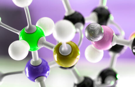 Close-up of a colorful molecular structure model symbolizing the UVS-Series by Nagase, a range of specialty chemicals designed for UV-curable formulations, providing enhanced durability, adhesion, and performance in coatings, inks, and adhesives.