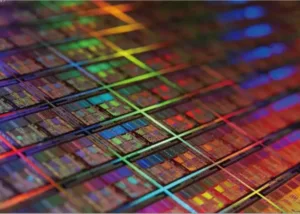 Close-up view of silicon wafers with colorful light reflections, representing TEOS-based thin film deposition for semiconductor manufacturing. Symbolic of Nagase's high-purity chemical solutions.