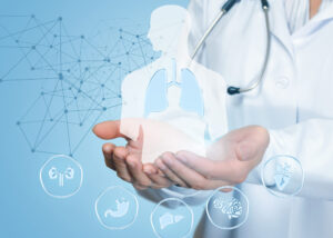 Doctor in white coat with stethoscope holding a holographic human body with lungs, surrounded by medical icons and connected data points, symbolizing Zink Assay Reagents by Nagase.