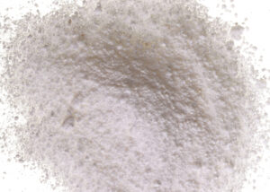 Fine white powder representing Arcofeliz™ EN Series low-endotoxin enzymes, including alginate lyase and collagenase, used as purified biomaterials for medical and pharmaceutical research, supplied by NAGASE.