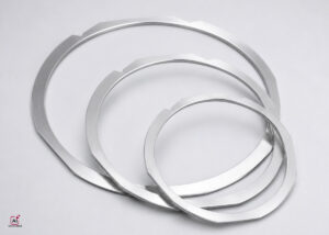 Precision stainless steel metal film frames for semiconductor wafer dicing, film mounting, and backend wafer handling processes.